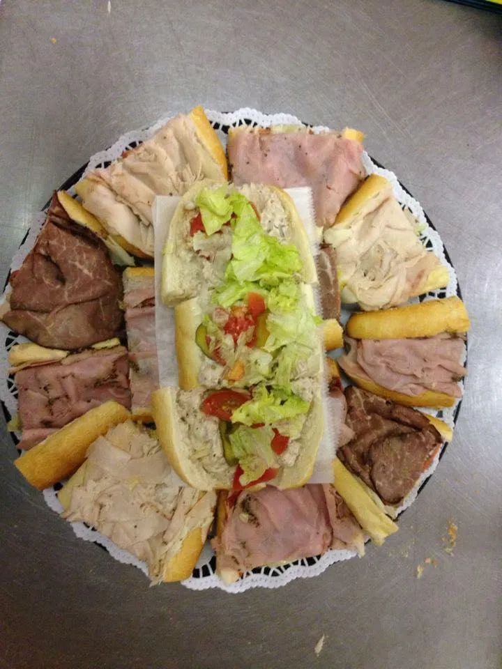 Assorted Hoagies Displayed on a Deli Tray